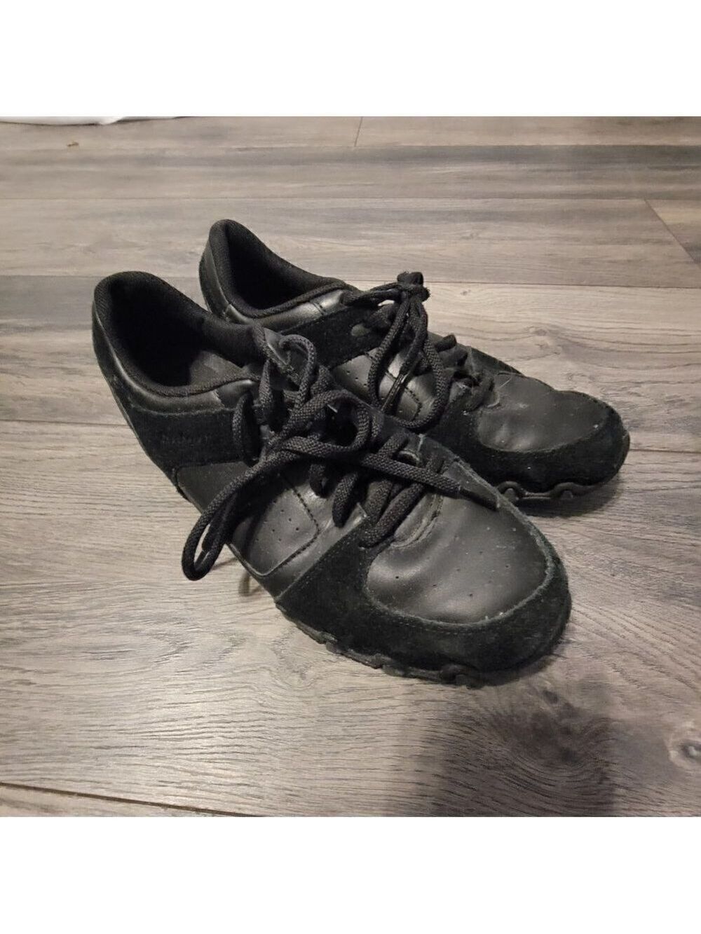 Skecher's black suede and leather sneaker.  Super comfortable.  Size 9